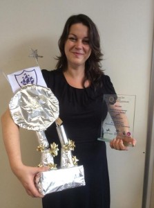 Becky celebrates with her two trophies. 