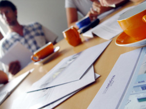 People in a meeting drinking coffee