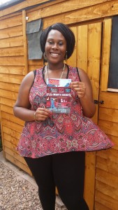 School for Social Entrepreneurs Fellow Rianna Raymond-Williams poses with a copy of her magazine Shine Aloud