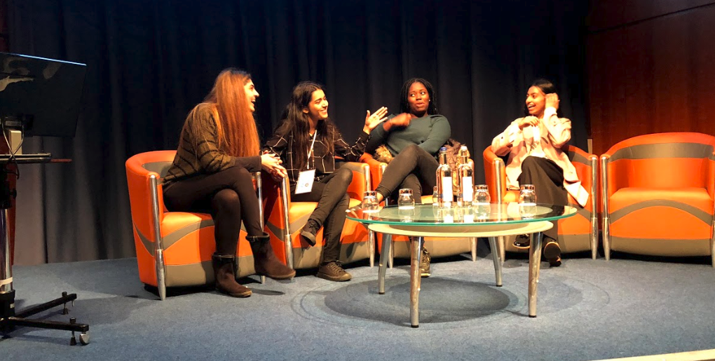 4 of the young talent participants sitting on stage having an animated conversation.