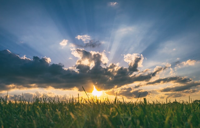 Photo of sun coming out of the clouds